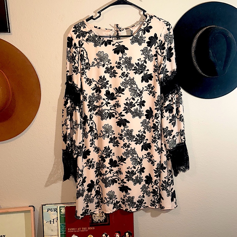 Blush floral dress, lace accents, tie around neck. Never worn.